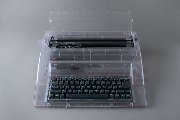photograph of a clear plastic typewriter